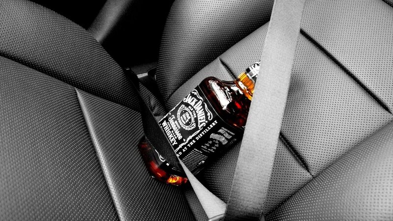 Jack Daniels bottle in car seat