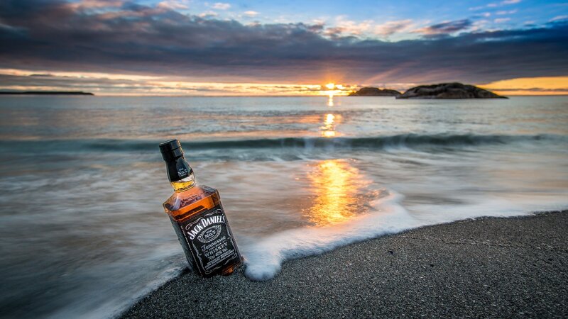 Jack Daniels Bottle on Beach
