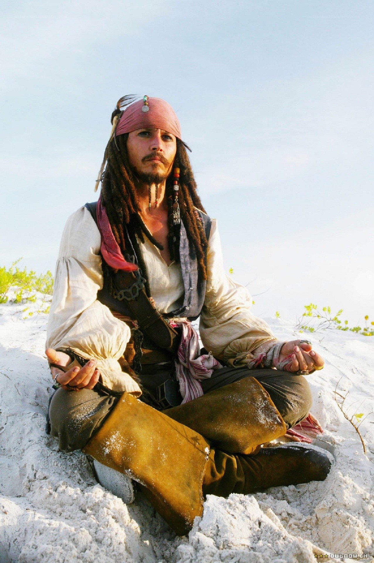 Jack Sparrow meditating on a beach