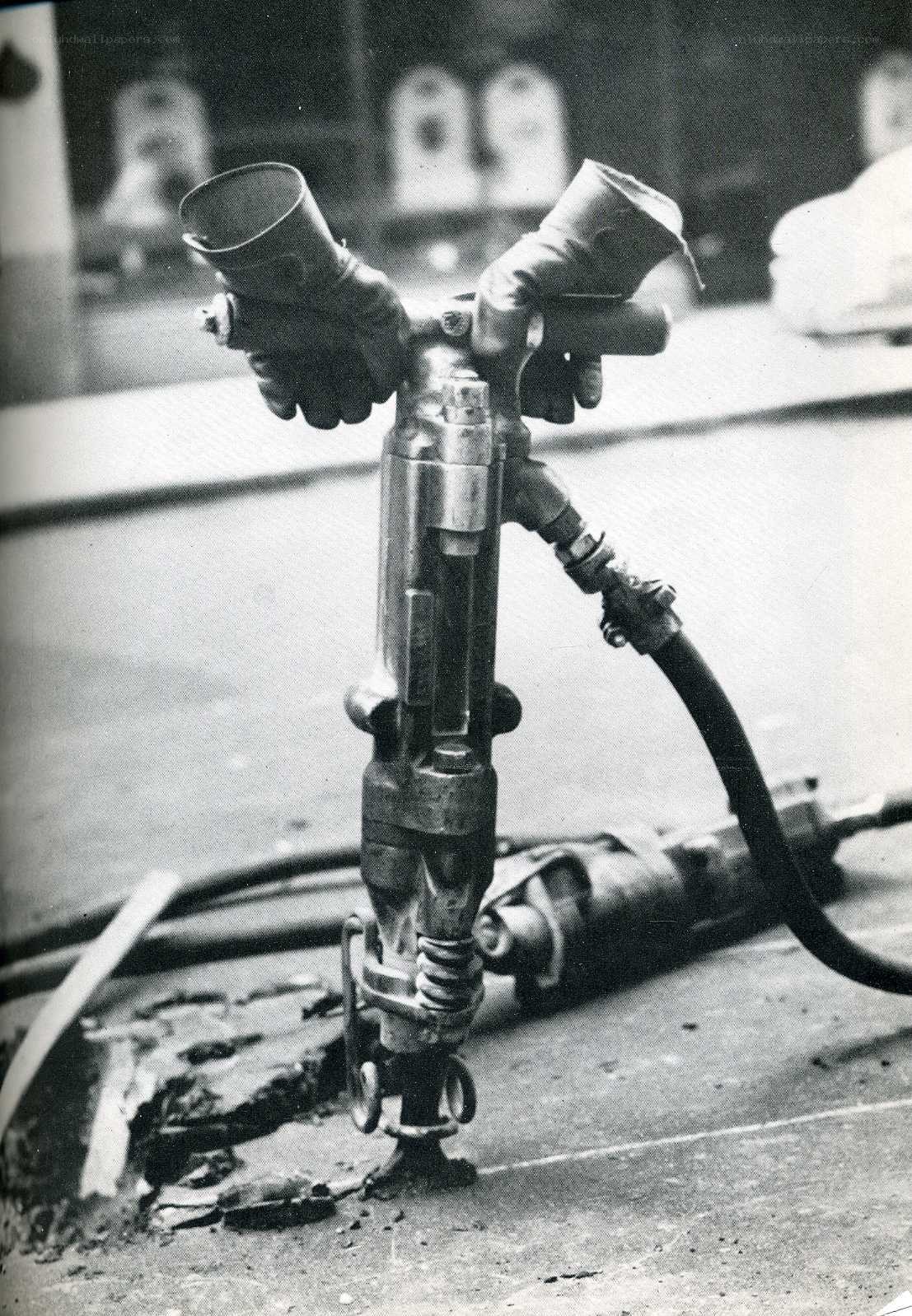 Jackhammer in use on pavement