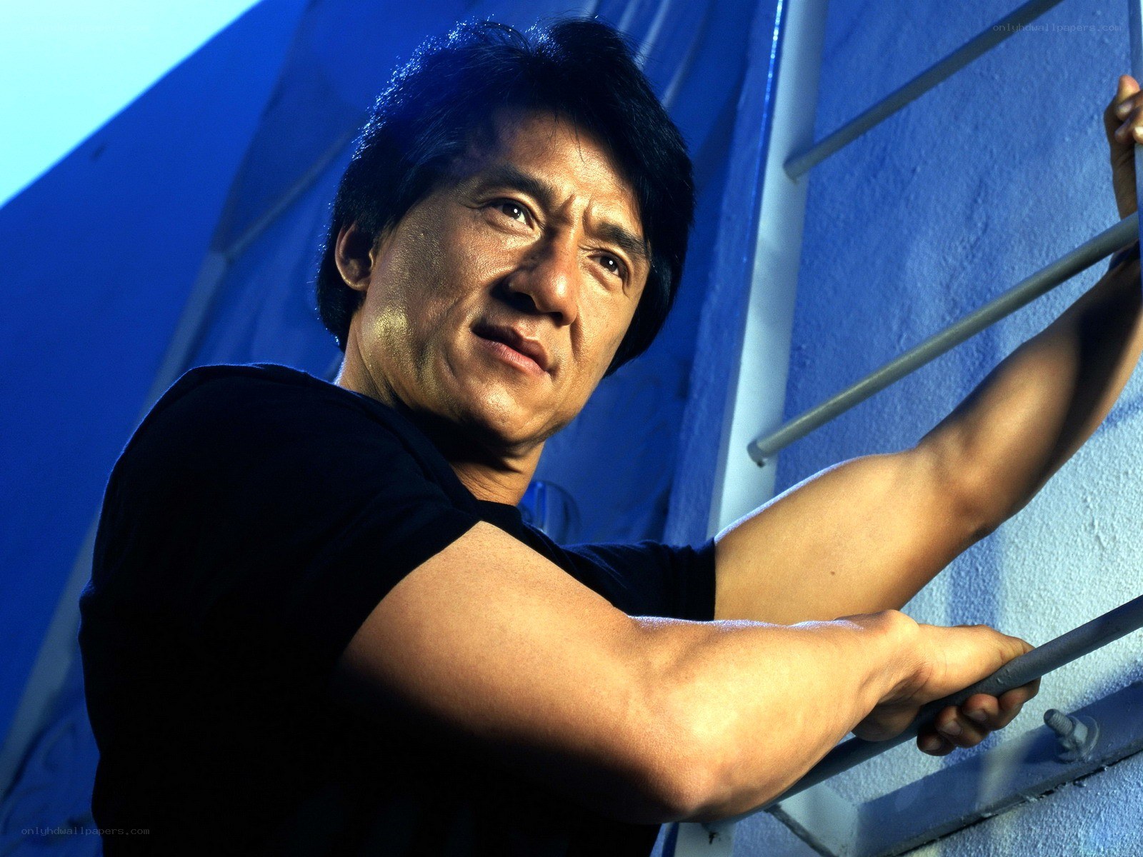 Jackie Chan on a ladder