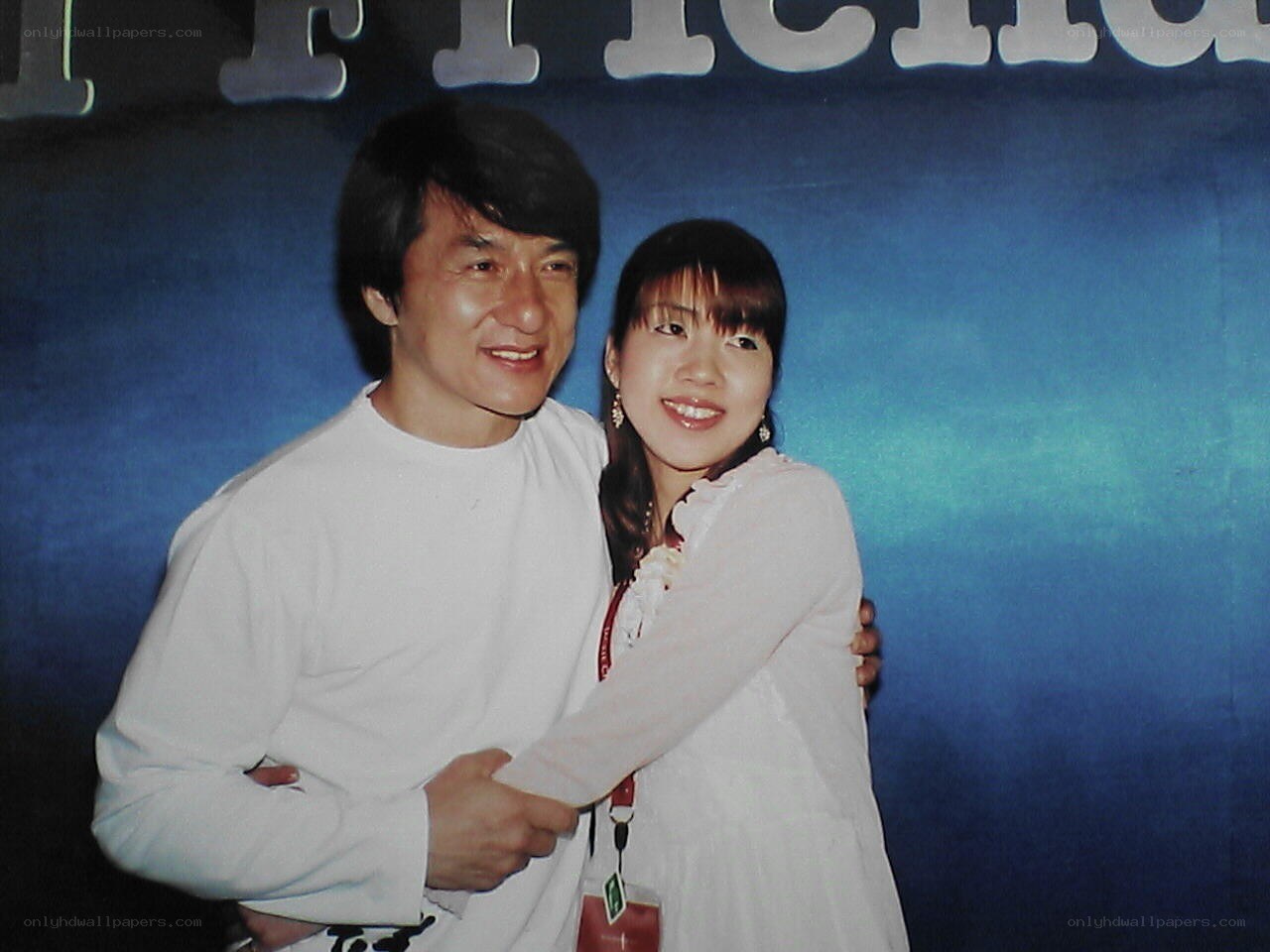 Jackie Chan with fan at event