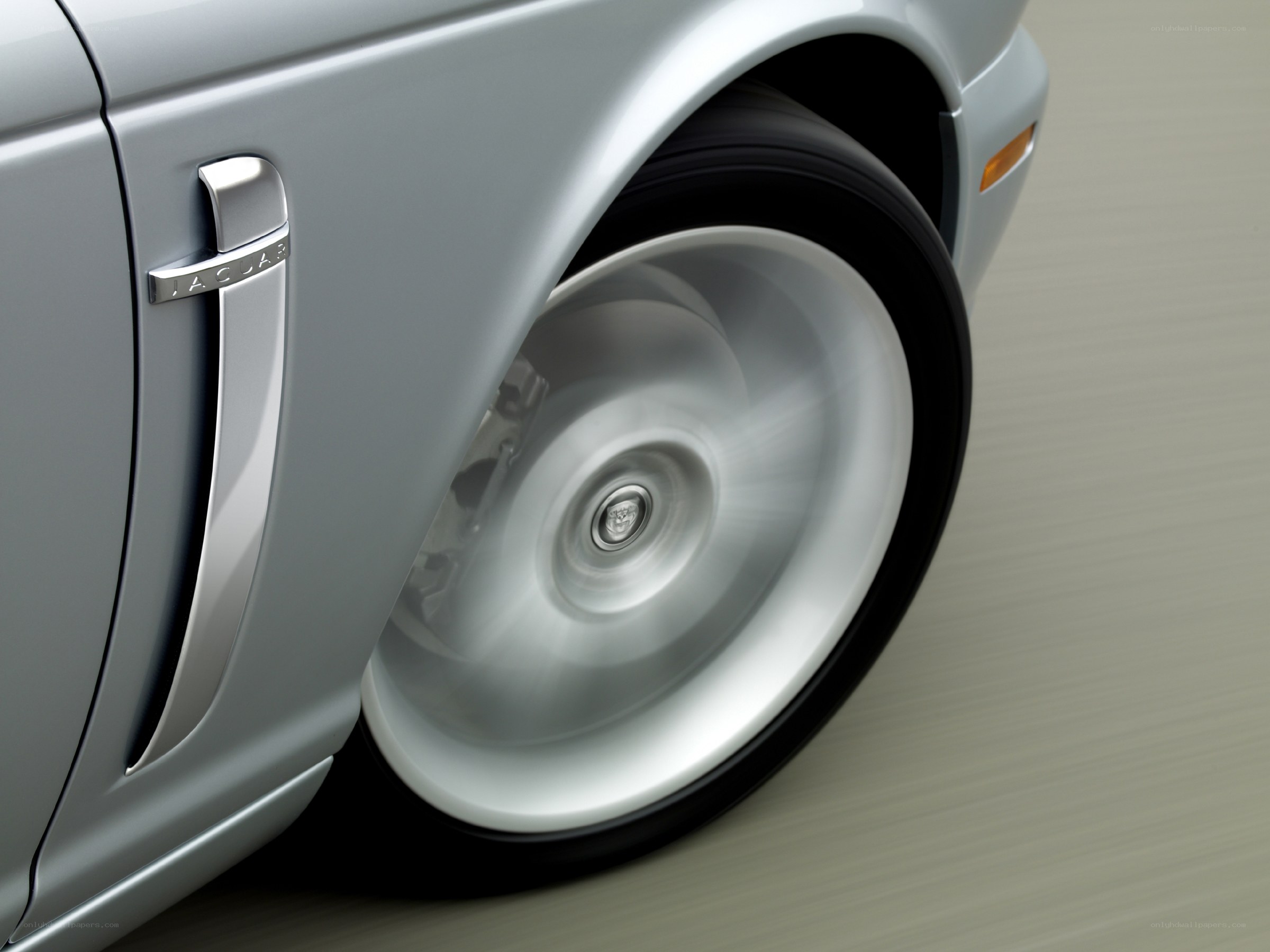 Jaguar car wheel in motion