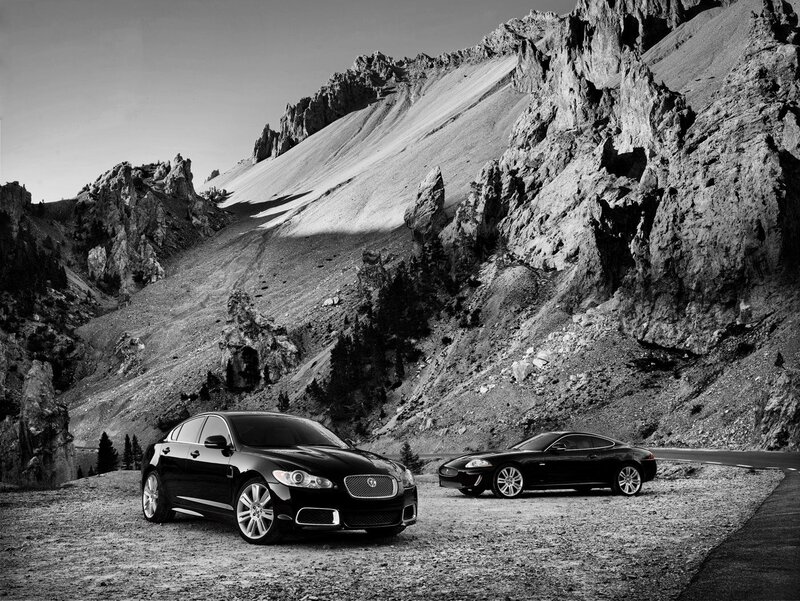 Jaguar cars in mountain landscape