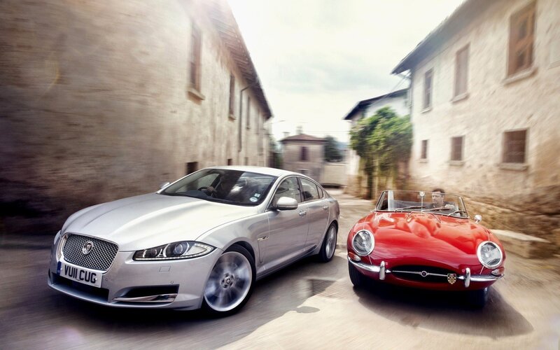 Jaguar cars on a road