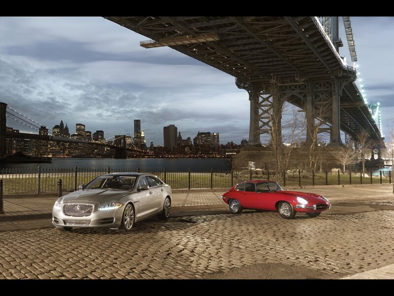 Jaguar cars under a bridge