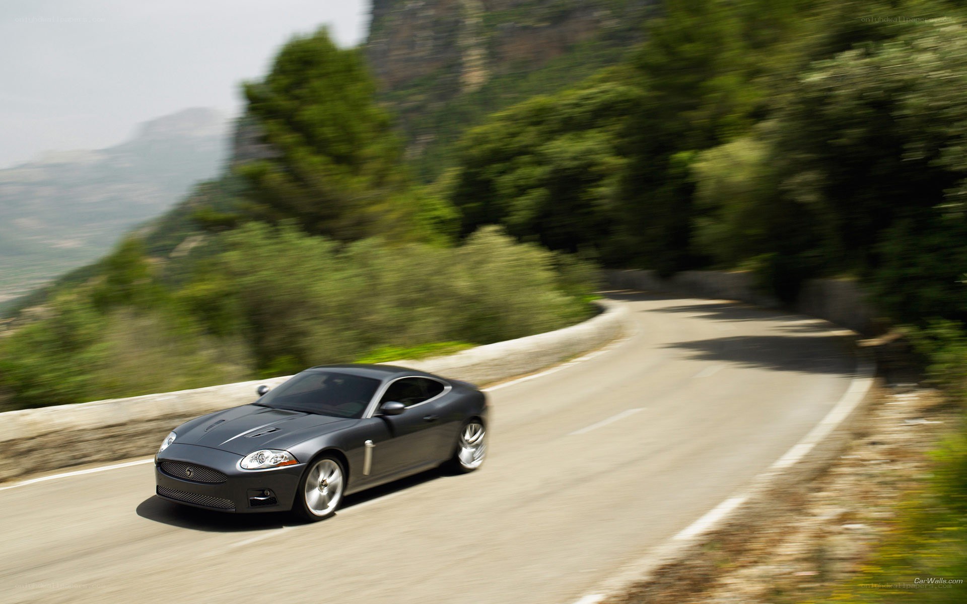 Jaguar coupe on winding road