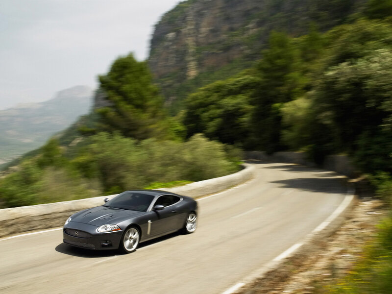 Jaguar coupe on winding road