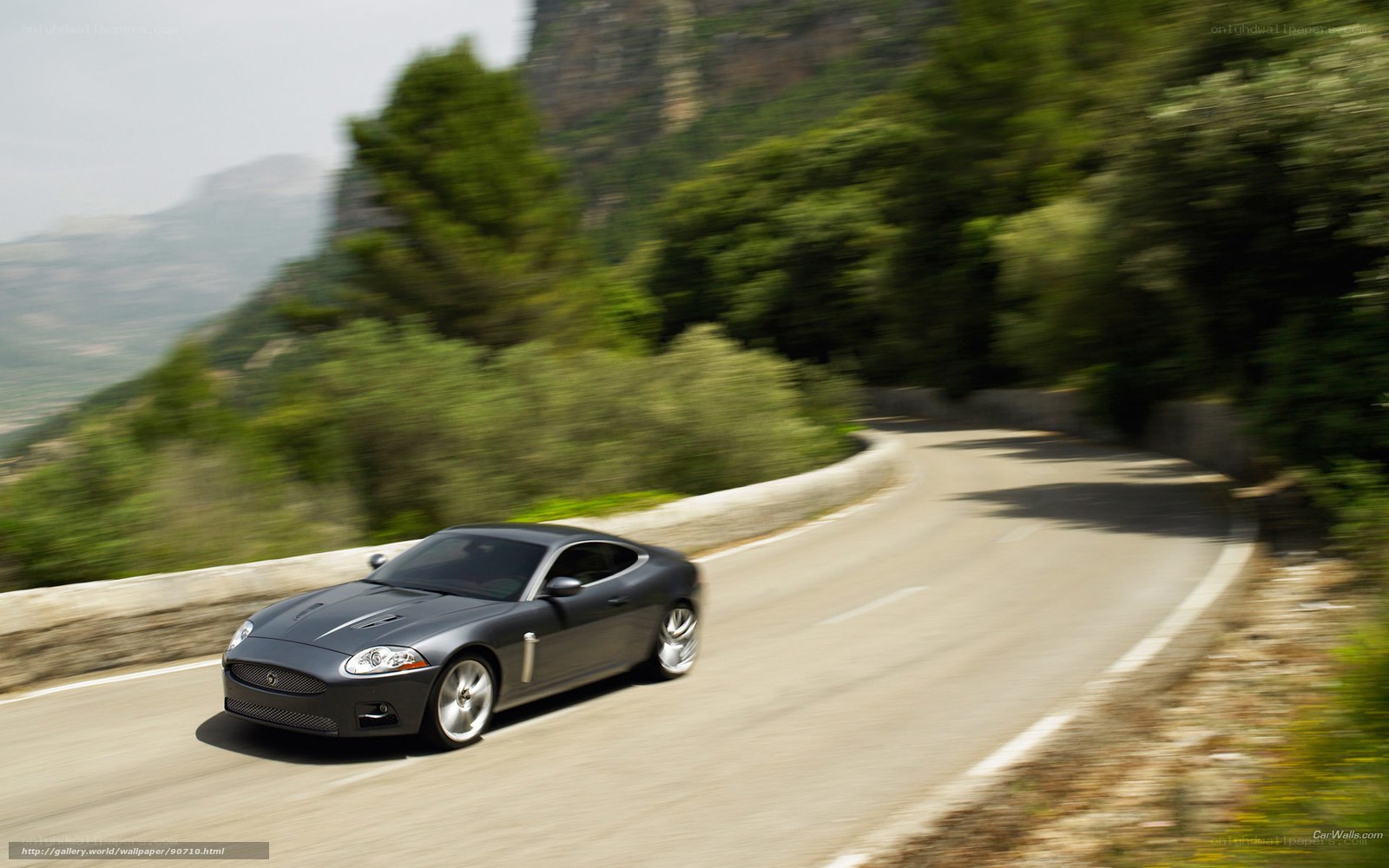 Jaguar coupe on winding road