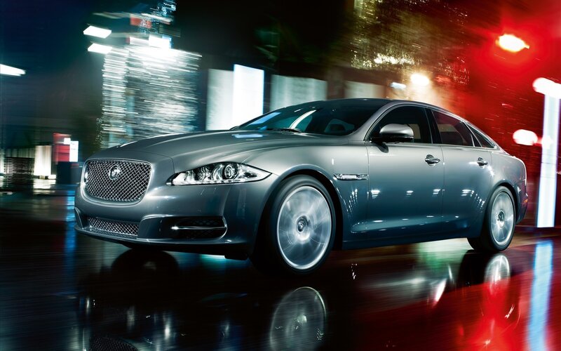 Jaguar luxury sedan at night