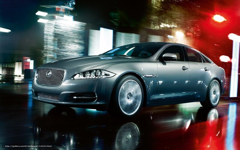 Jaguar luxury sedan at night