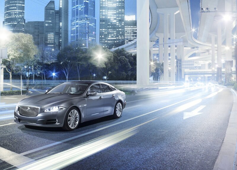 Jaguar luxury sedan on city road