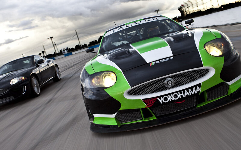 Jaguar race cars on track