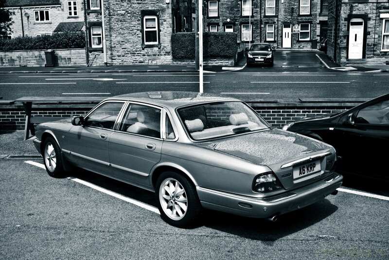 Jaguar X300 parked on street