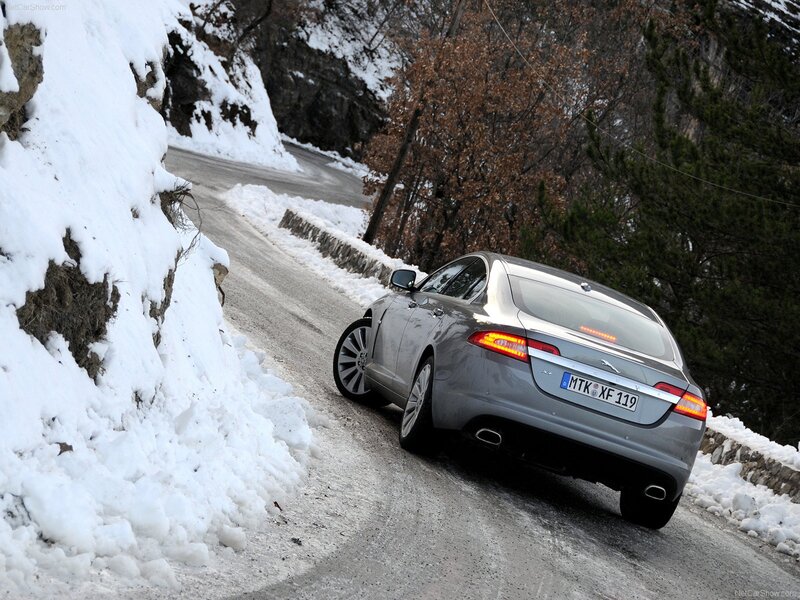 Jaguar XF on snowy mountain road