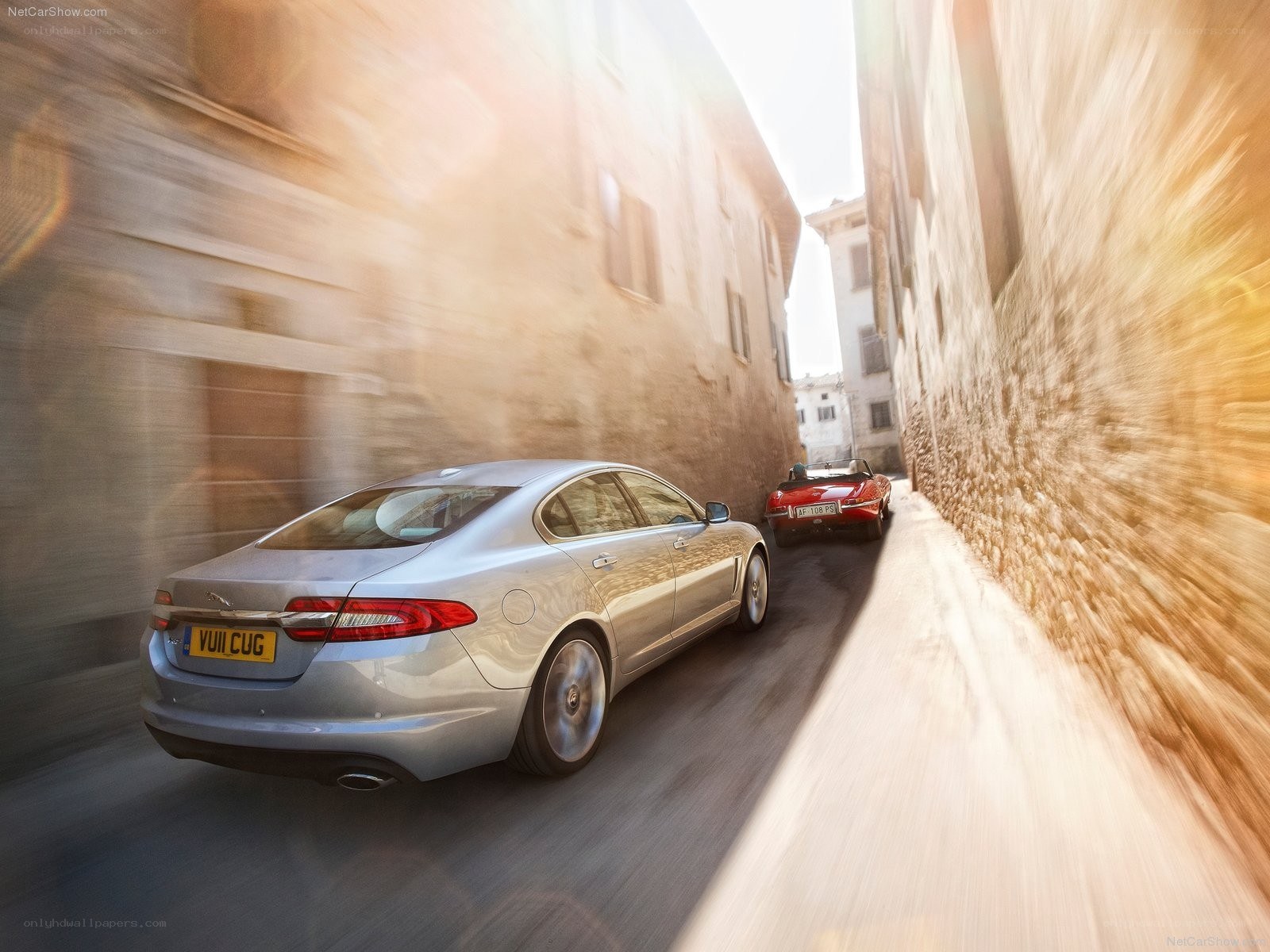 Jaguar XJ driving through narrow street
