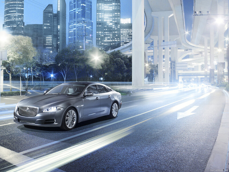 Jaguar XJ in city at night