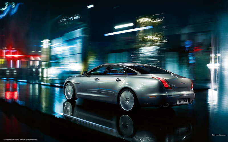 Jaguar XJ in city at night
