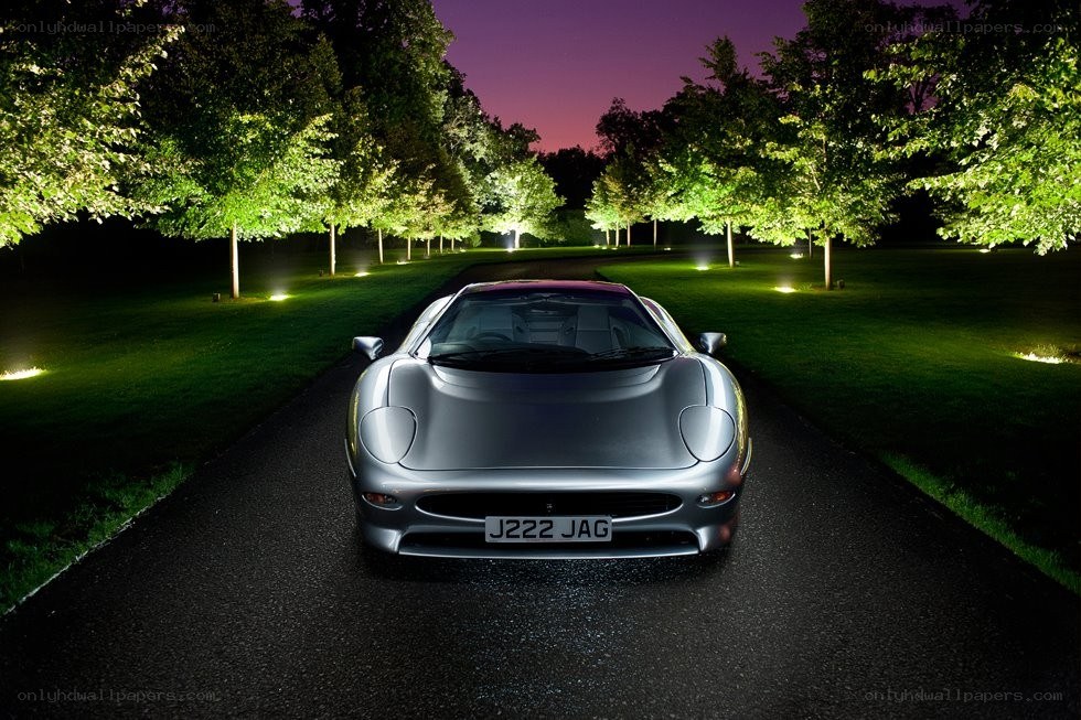 Jaguar XJ220 on a lit path