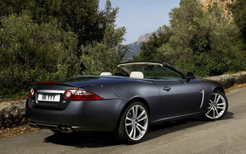 Jaguar XK convertible on a scenic road