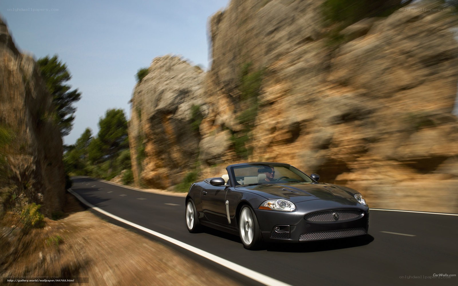 Jaguar XK convertible on mountain road