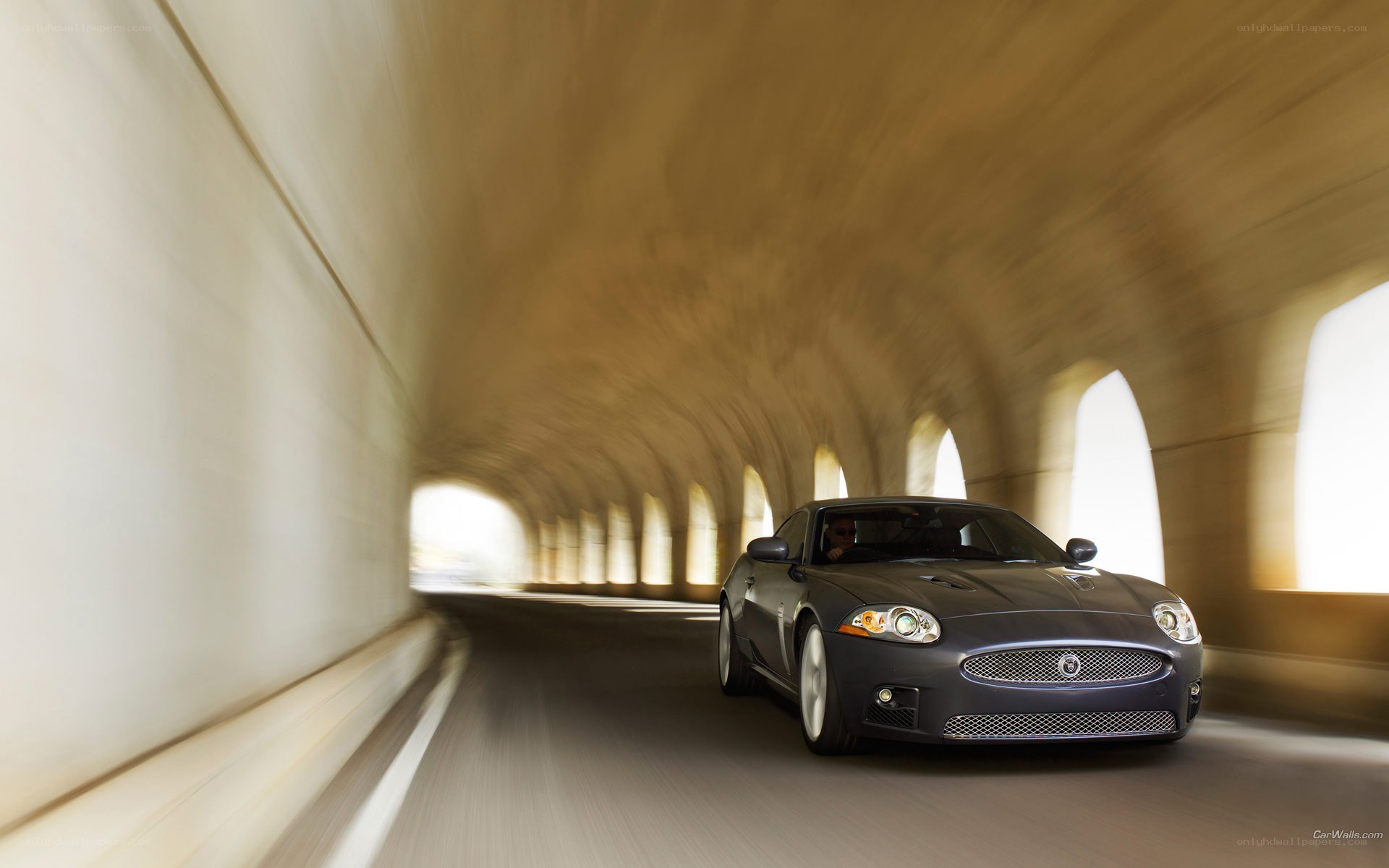 Jaguar XK driving through tunnel