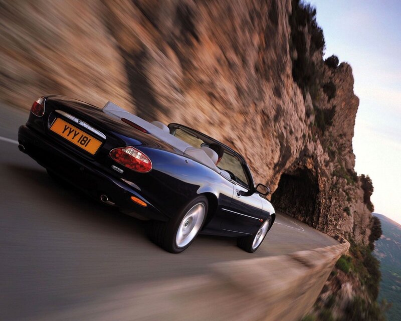 Jaguar XK8 convertible on coastal road