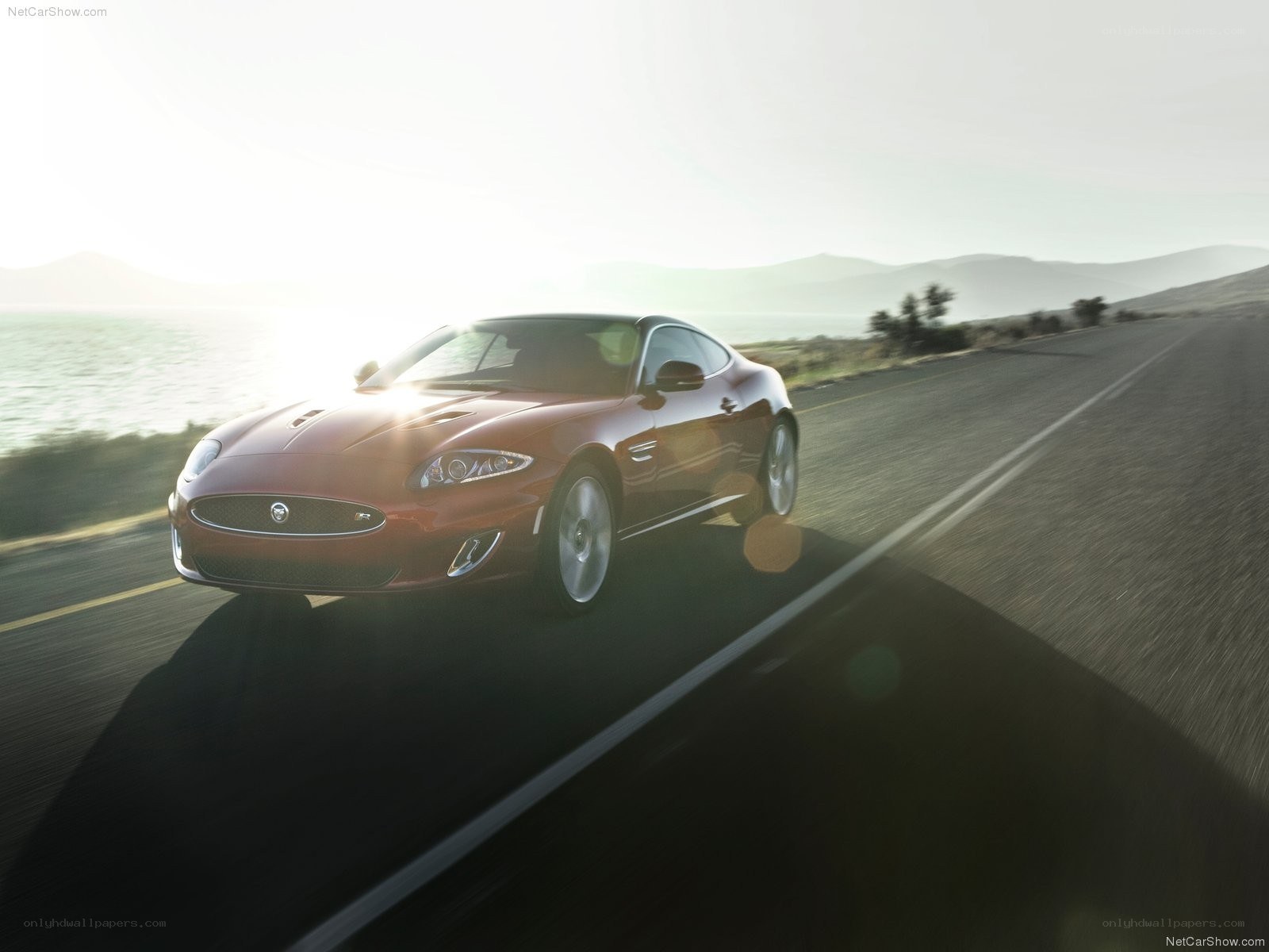 Jaguar XKR speeding on coastal road