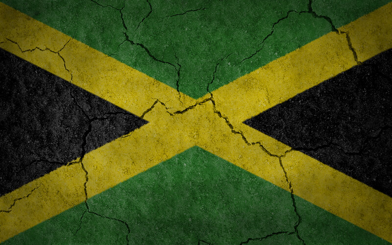 Jamaican flag on cracked surface