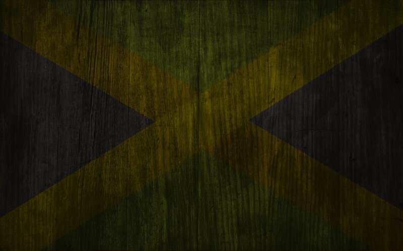 Jamaican flag on wood texture