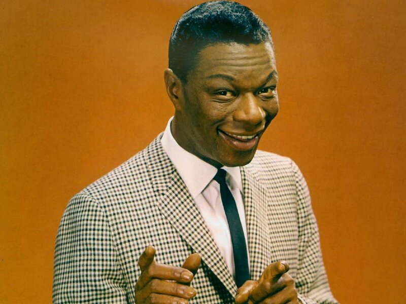 James Brown smiling in a suit