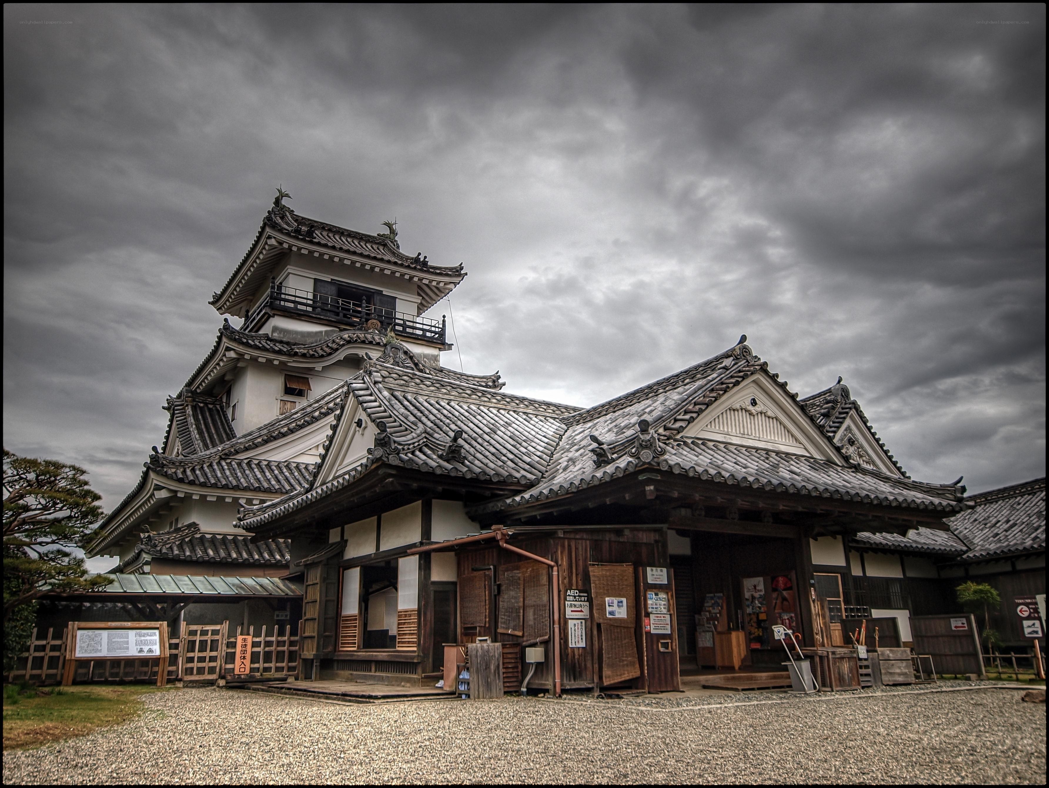 Japanese castle under cloudy sky