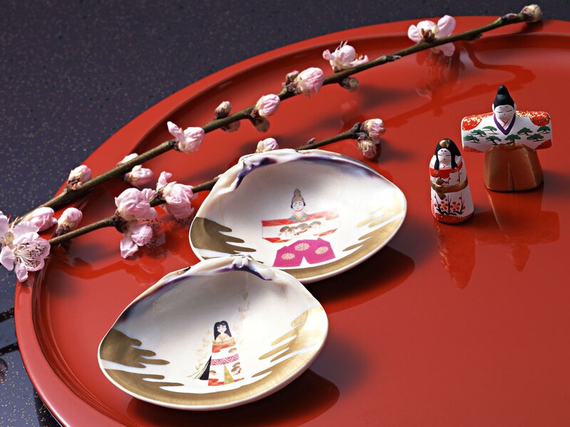 Japanese dolls on red tray