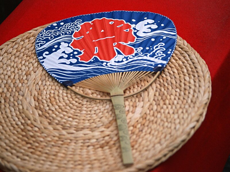 Japanese fan on woven mat
