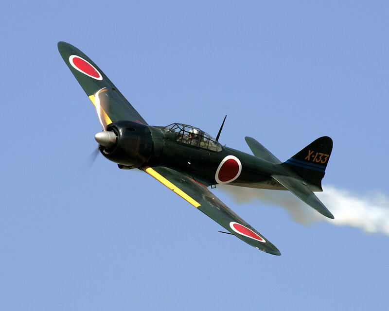 Japanese Fighter Plane — Blue, Dynamic, Afternoon