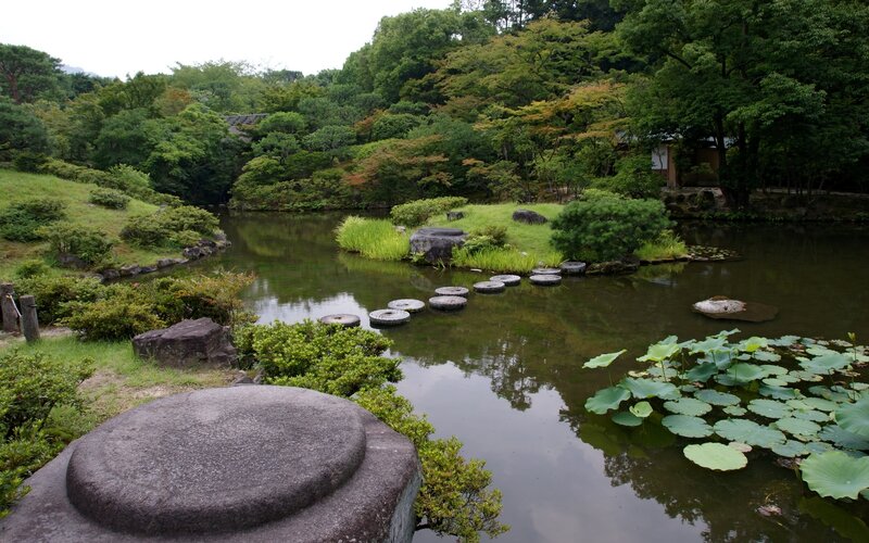 Japanese garden pond with stepping stones
