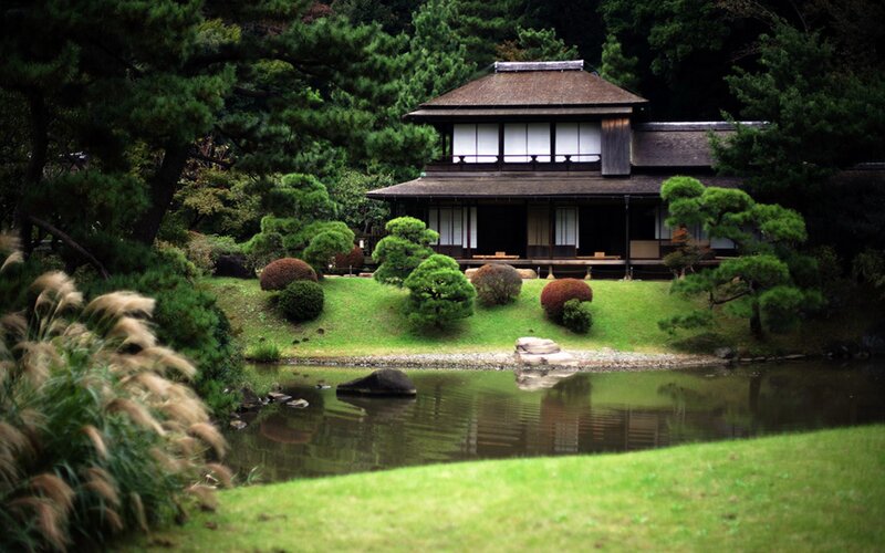 Japanese garden with pond and house