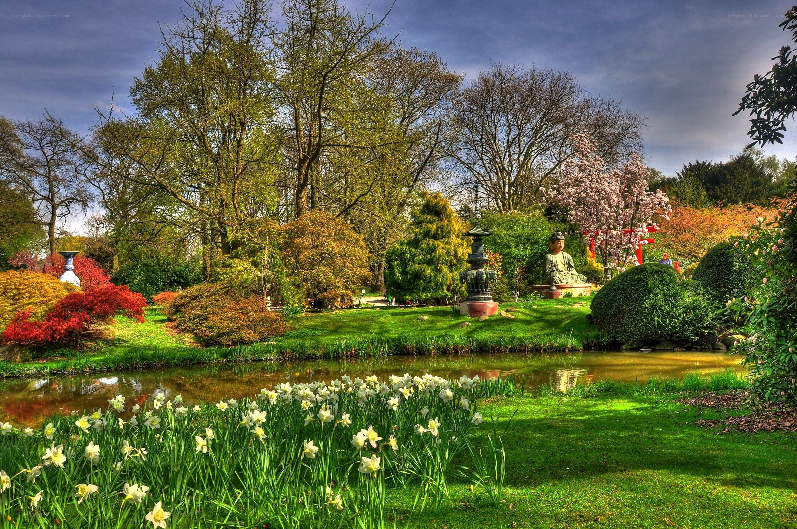 Japanese garden with pond and statue