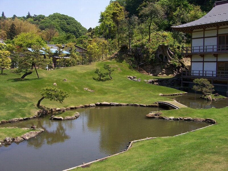 Japanese garden with pond and temple