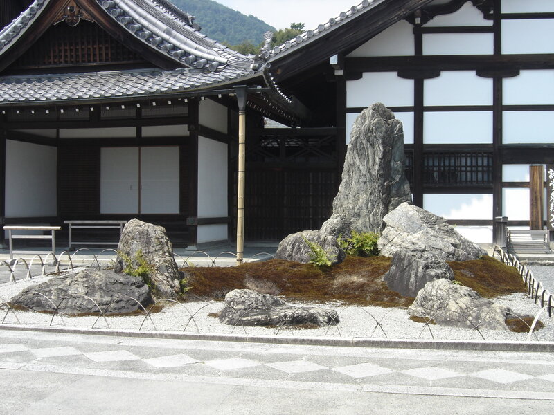 Japanese garden with rocks and temple