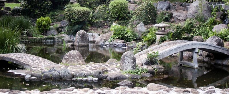 Japanese garden with stone bridge