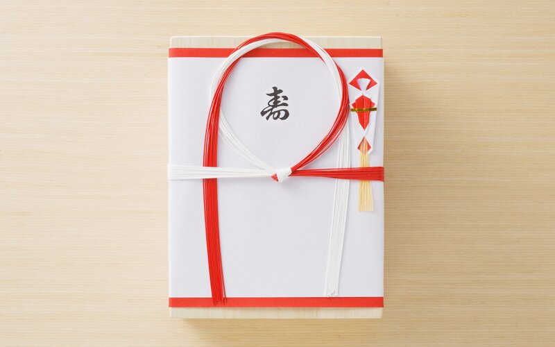 Japanese gift box with red and white ribbon