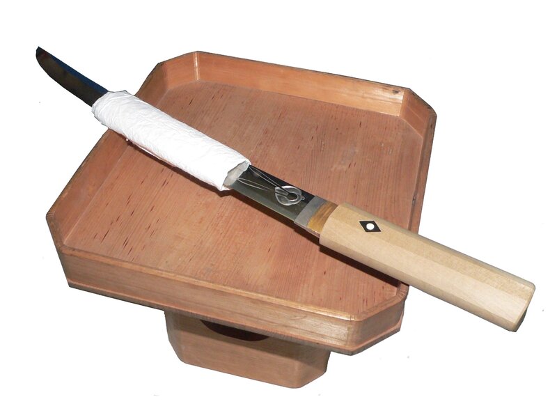 Japanese knife on wooden tray