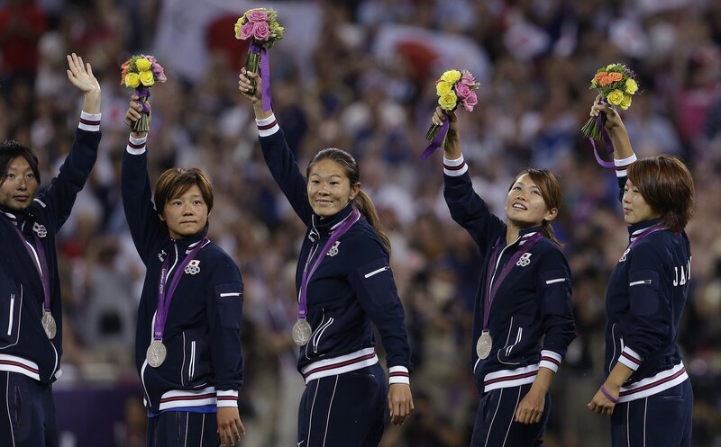 Japanese softball team on podium