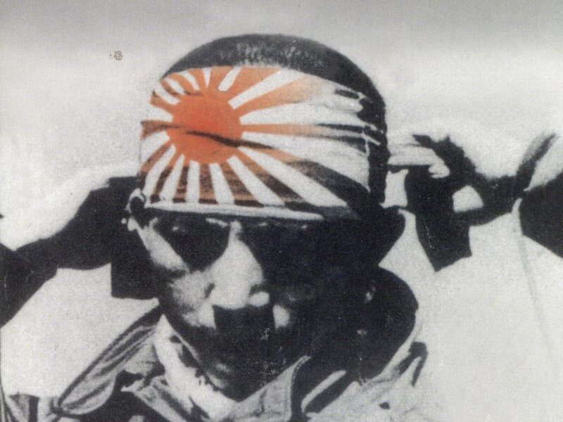 Japanese soldier with rising sun flag