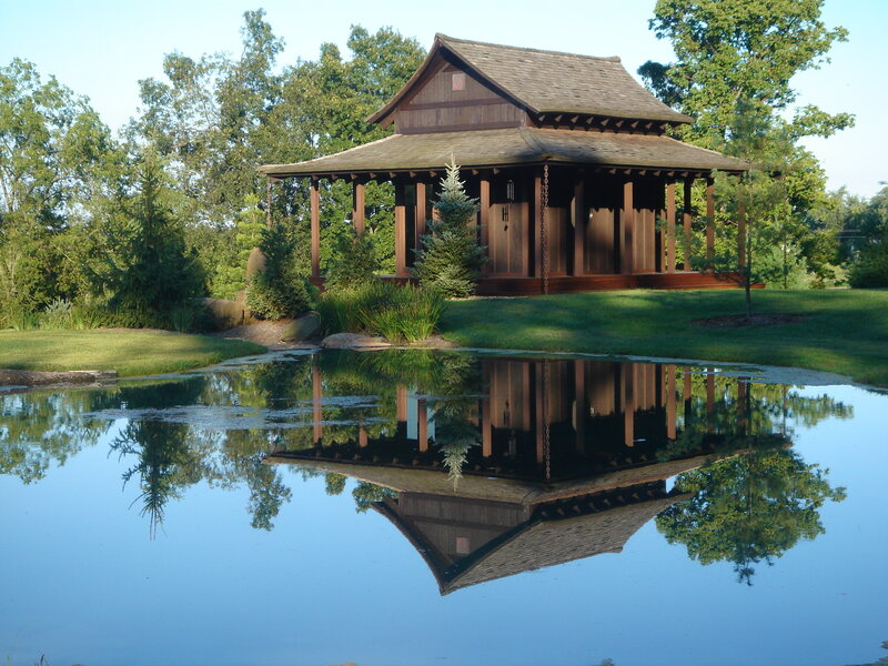 Japanese-style pavilion by pond