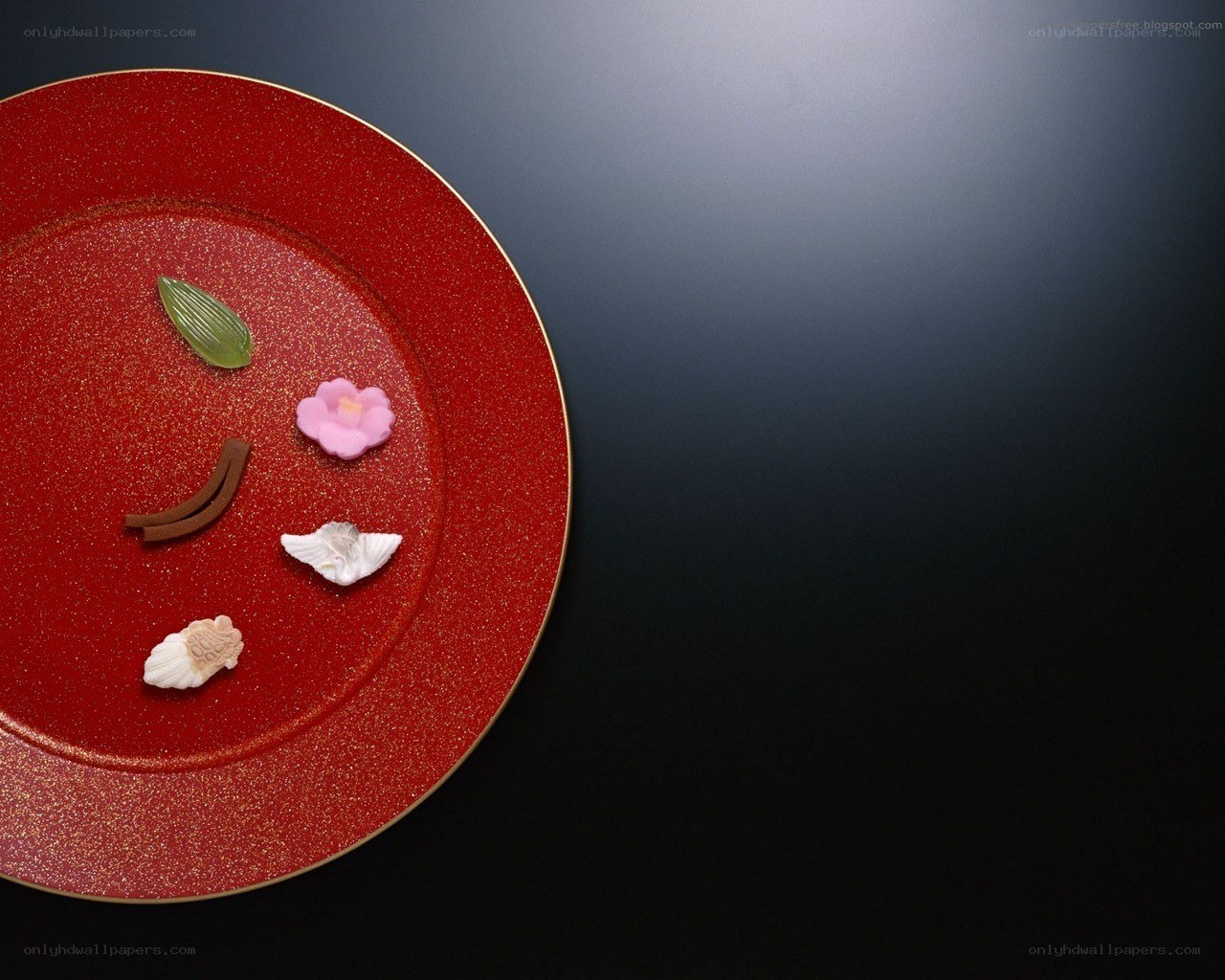 Japanese sweets on red plate