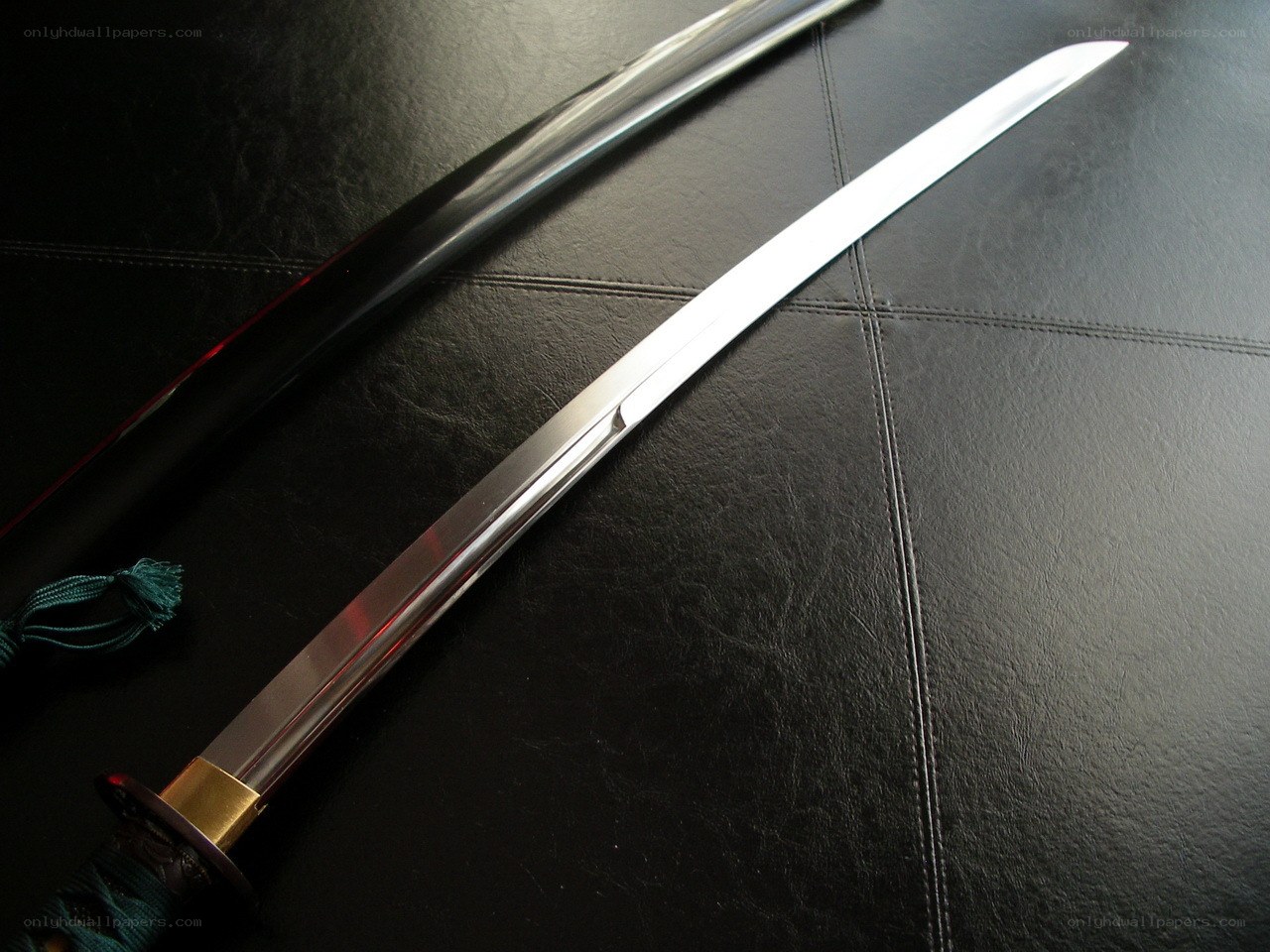 Japanese sword on black leather