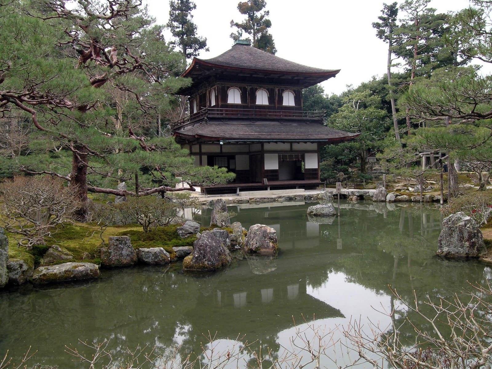 Japanese temple by a pond