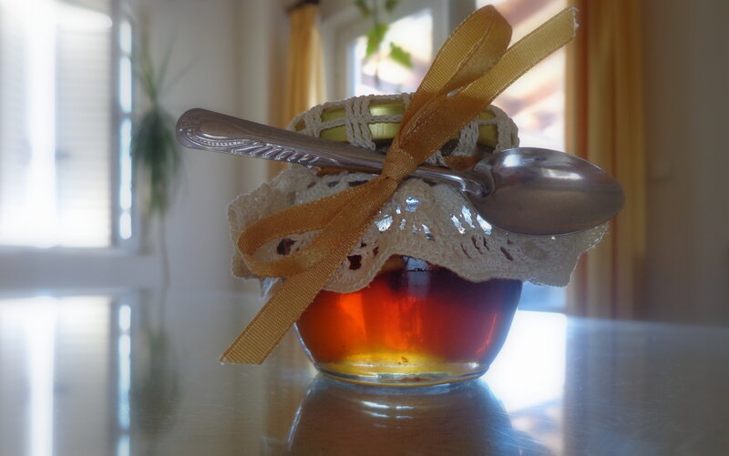 Jar of Honey with Spoon